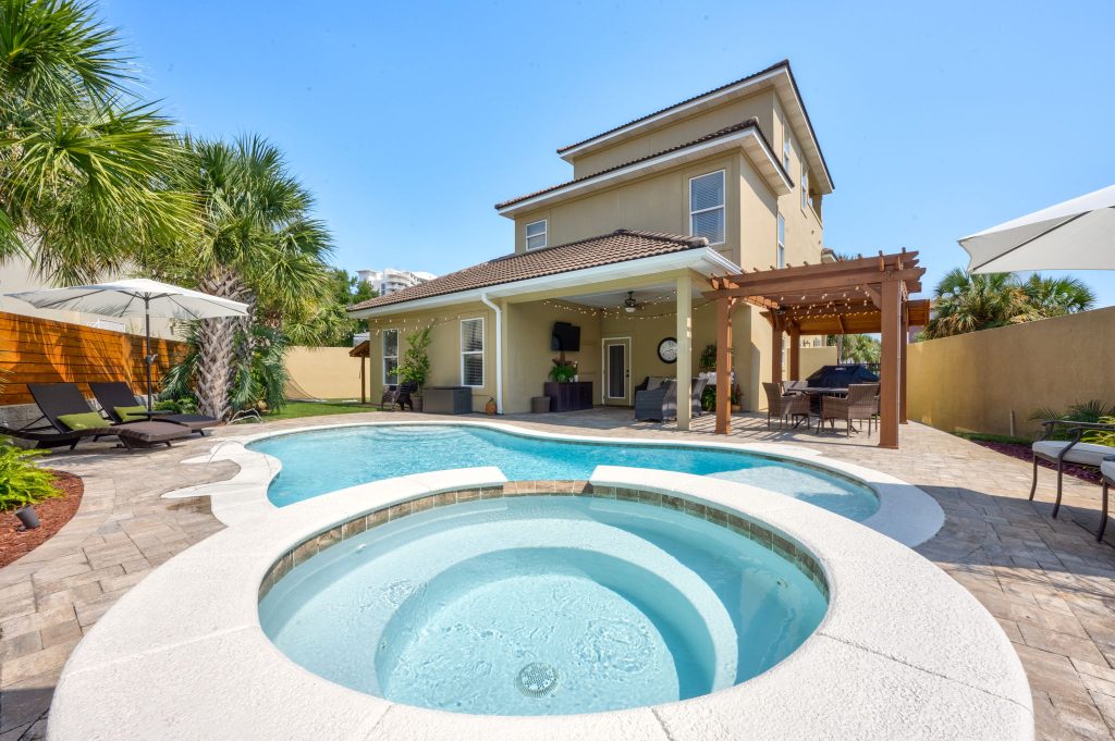 custom-designed heated saltwater pool with tanning ledge & water features