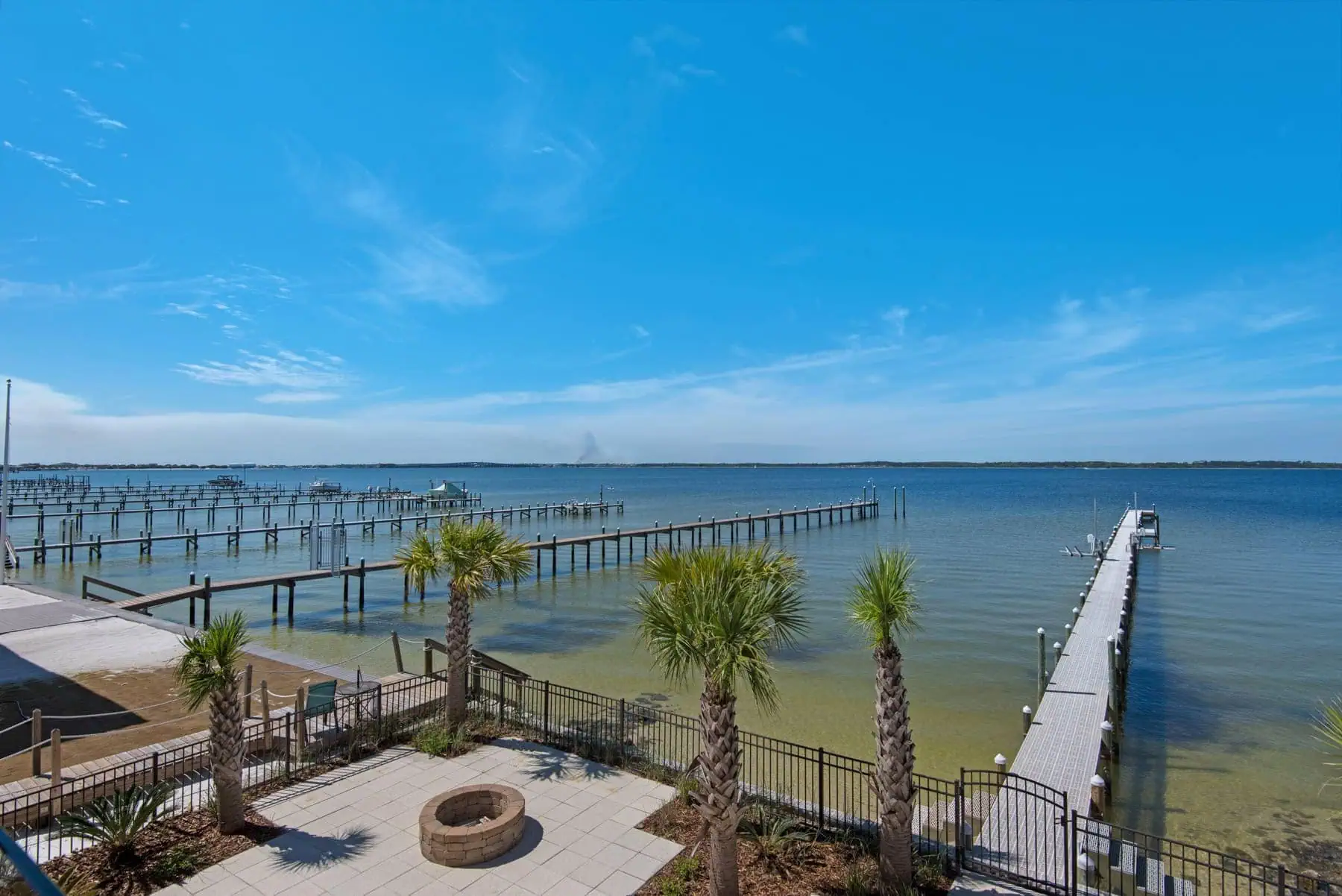 Waterfront Mediterranean estate with 105 feet of Santa Rosa Sound frontage and concrete pilings.