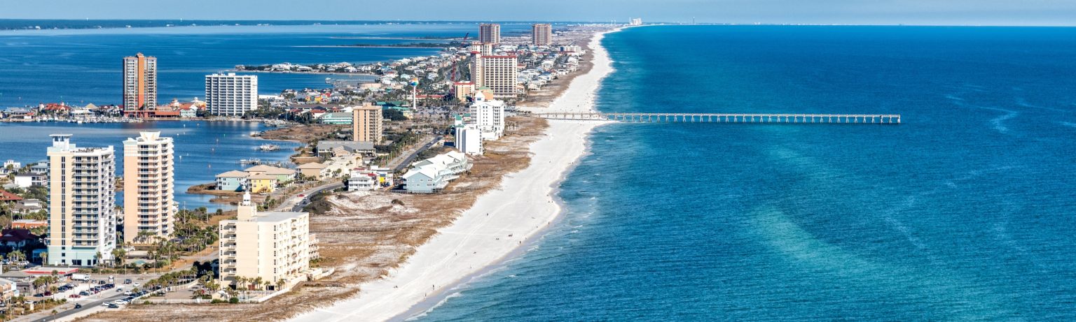 Aerial view of Pensacola Beach and the Florida Gulf Coast shoreline for summer activities.