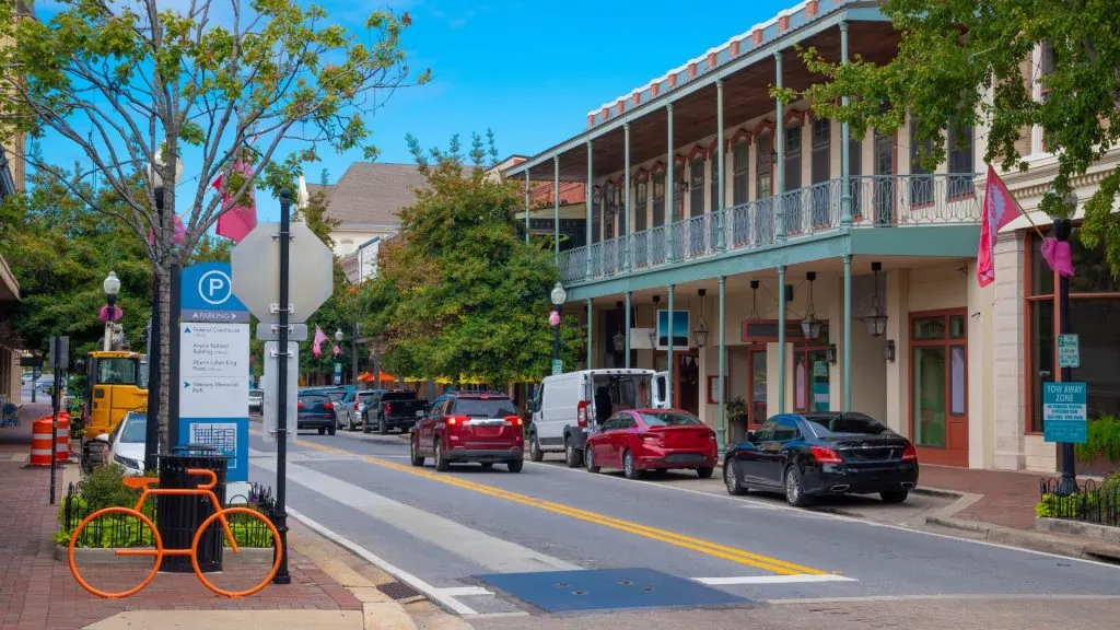 Pensacola street scene and architecture reflecting community involvement and local culture.