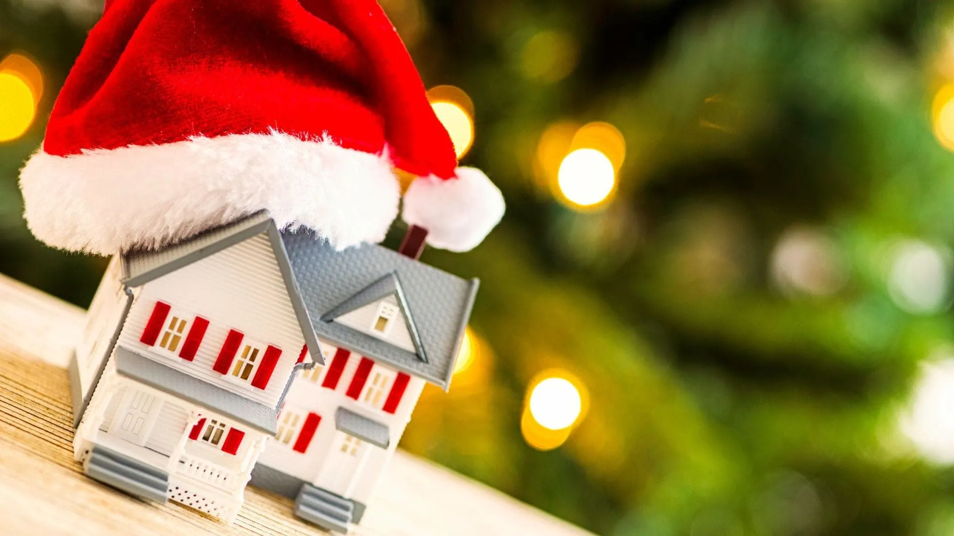 Christmas home decor and model house illustrating holiday home sales.
